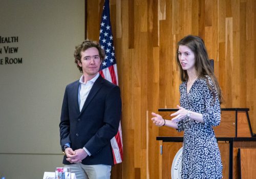 Two students presenting their Ideas to Action project